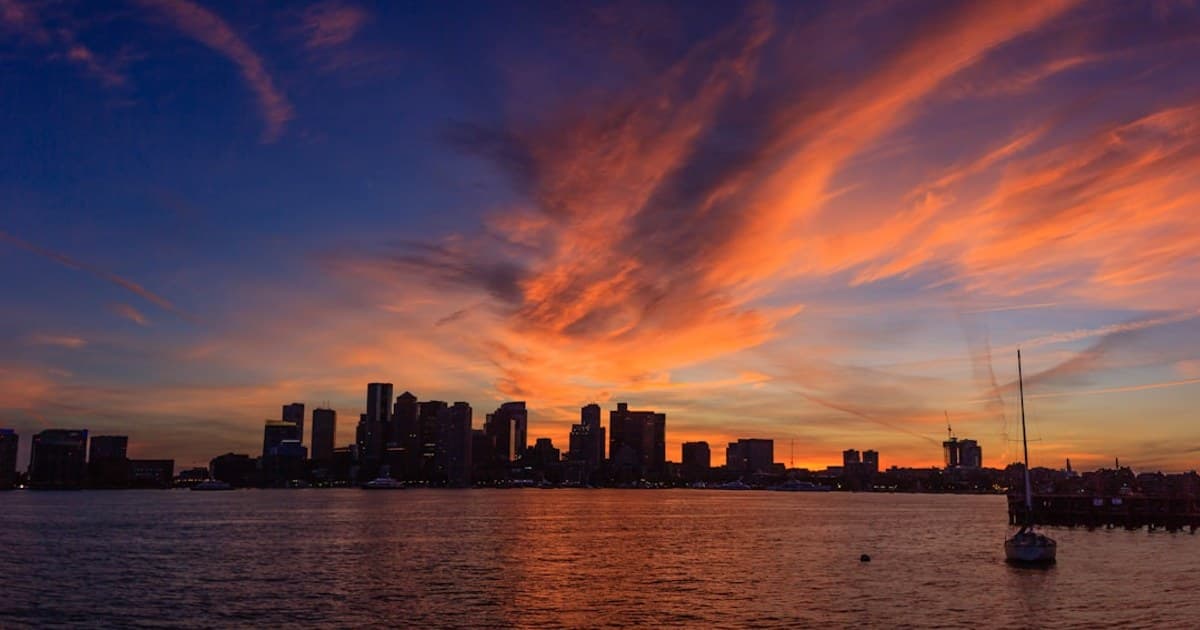 View of the Boston skyline during sunset from Pier Park