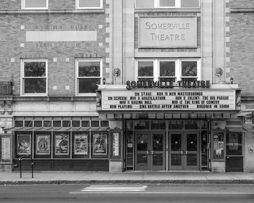 Front view of Somerville Theatre in Massachusetts with event marquee, black and white photo.